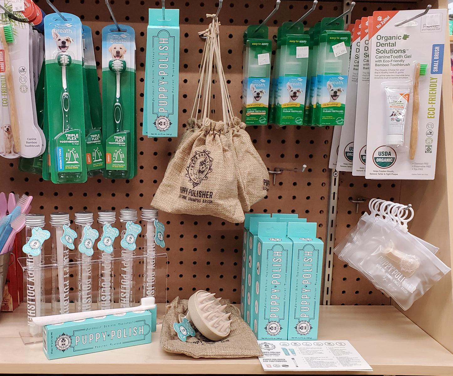 Store Photo with Puppy Polish Toothpaste and toothbrushes, finger brush and shampoo brush